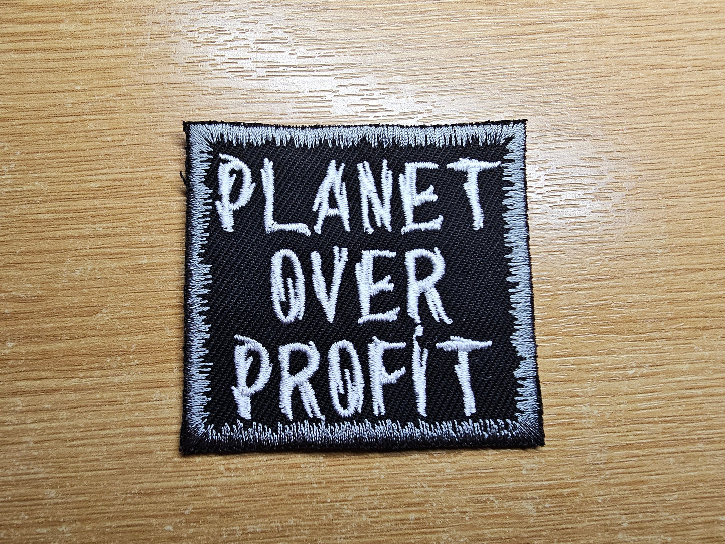 Planet Over Profit Embroidered Patch Grey Climate Crisis Environmental Action