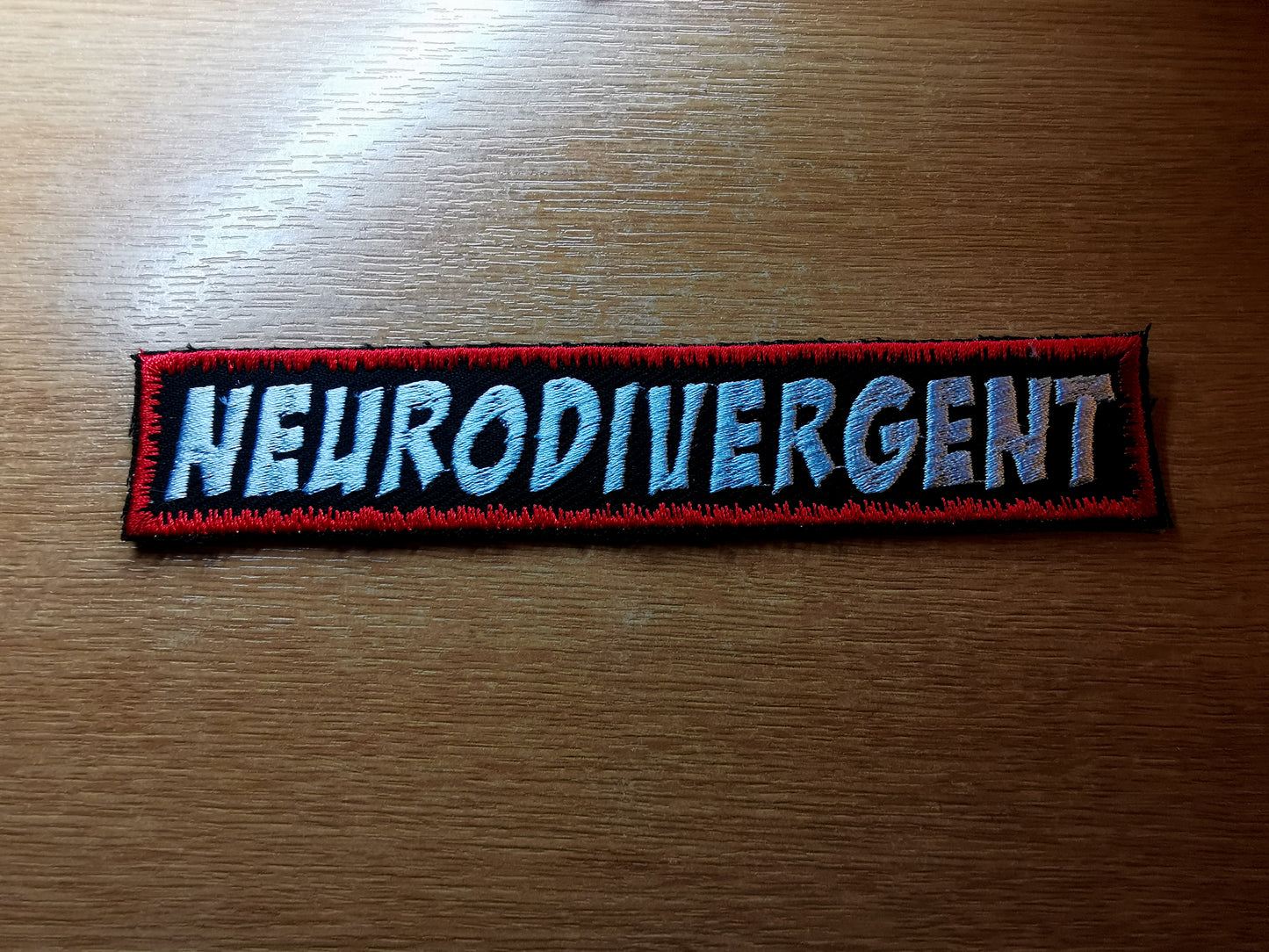 Neurodivergent Embroidered Patch Long Red Snow Comic Book Style