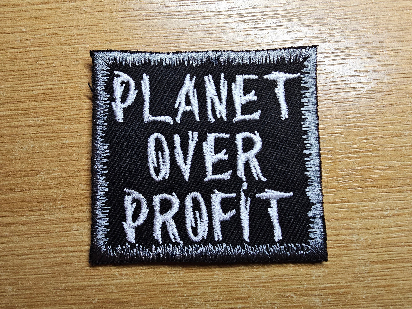 Planet Over Profit Embroidered Patch Grey Climate Crisis Environmental Action