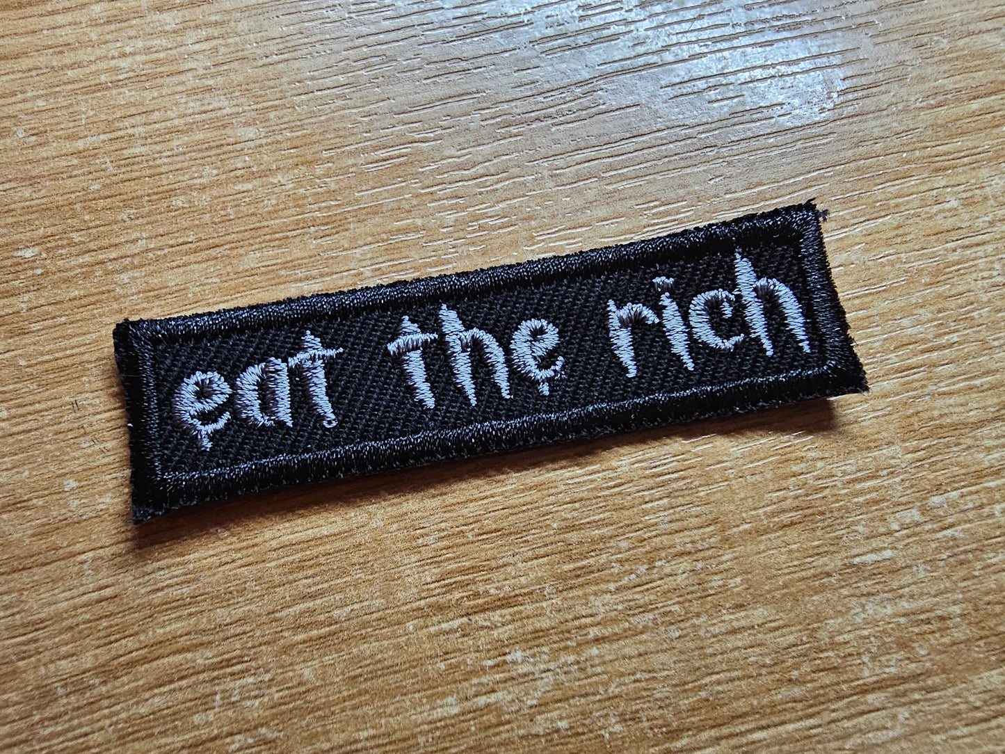 Eat The Rich MINI Embroidered Iron On Patch Politics Punk and Goth - Very small! Grey and Black